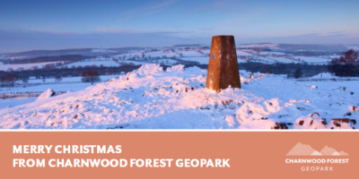 A banner featuring a picture of a snowy hill top and the words Merry Christmas from Charnwood Forest Geopark